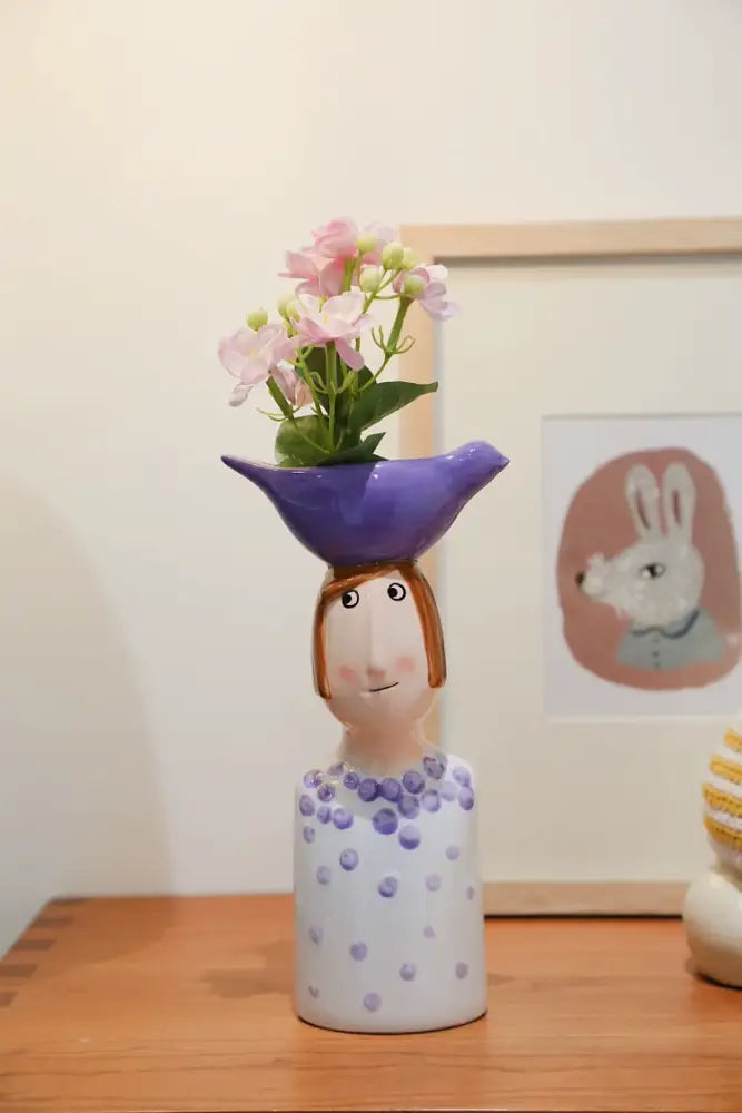 DecorBites™ ceramic vase set featuring a whimsical white and purple polka dot vase shaped like a girl for home decor