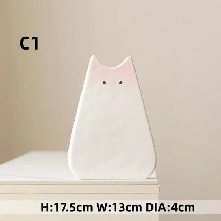 DecorBites™ charming cat-inspired ceramic vase is a minimalist white ceramic vase with pink blush for living room decor