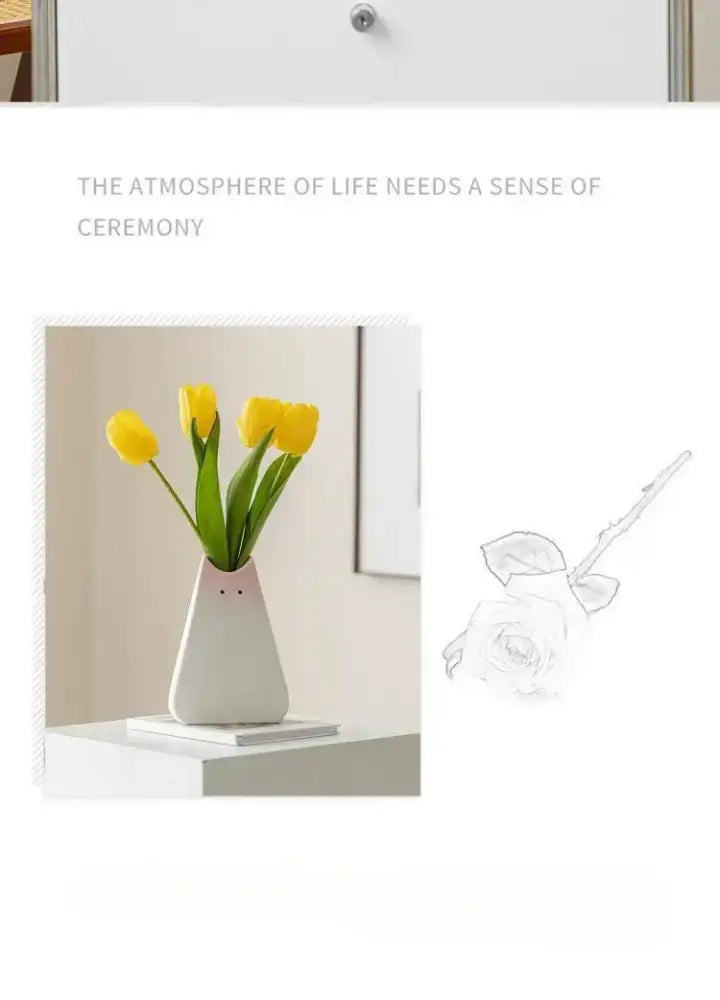 White ceramic vase with cute face design holding yellow tulips decorbites™ cat ceramic vase for living room decor