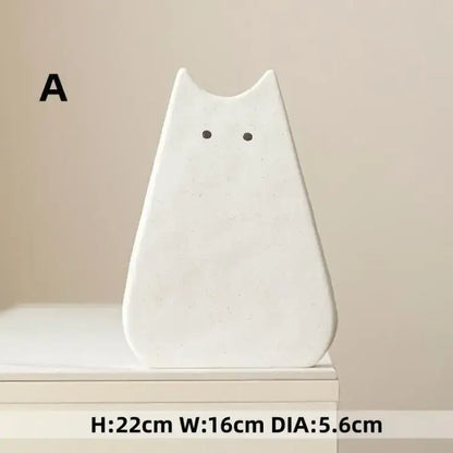 DecorBites™ charming cat-inspired white ceramic vase with minimalist design and black dot eyes for living room decor