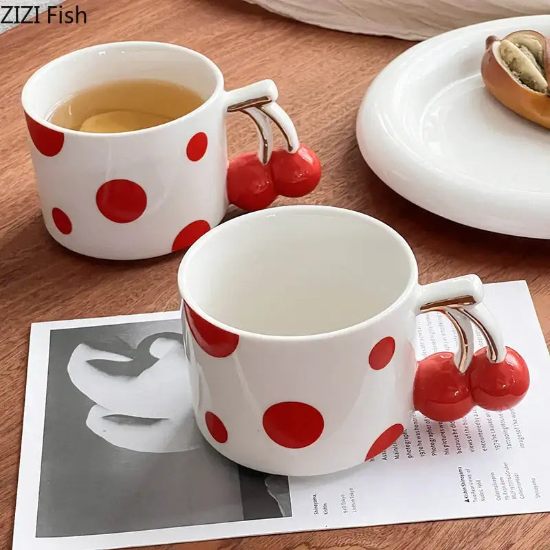 White ceramic porcelain coffee mug with decorbites cherry handle gold plated red polka dots design