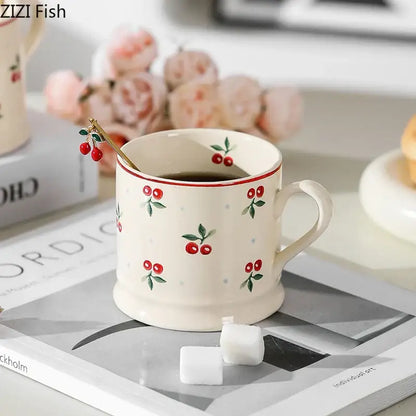Cream-colored creamBites™ cherry pattern porcelain coffee mug with lovely cherry decals and gold-toned spoon inside