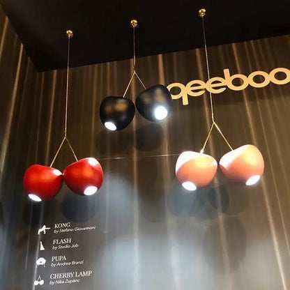 Decorbites cherry pendant lamp with glossy red black and peach glossy shades and gold-toned hanging wires for home decor