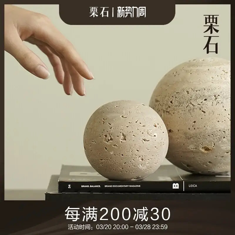 Two beige textured stone spheres with a rough porous surface decorbites wabi sabi wind geometric rock ornaments