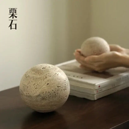 Beige textured chestnut stone spheres with a natural rustic finish decorbites wabi sabi wind geometric ornaments