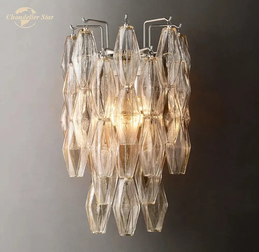 DecorBites™ Chiara glass LED wall sconce with a metallic frame and cascading translucent glass shades catching light
