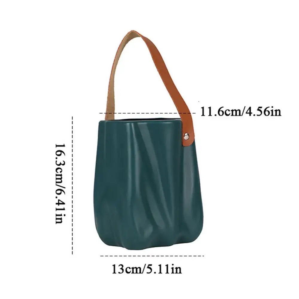 Teal ceramic vase with tan leather handle from decorbites chic ceramic vase collection for home decoration
