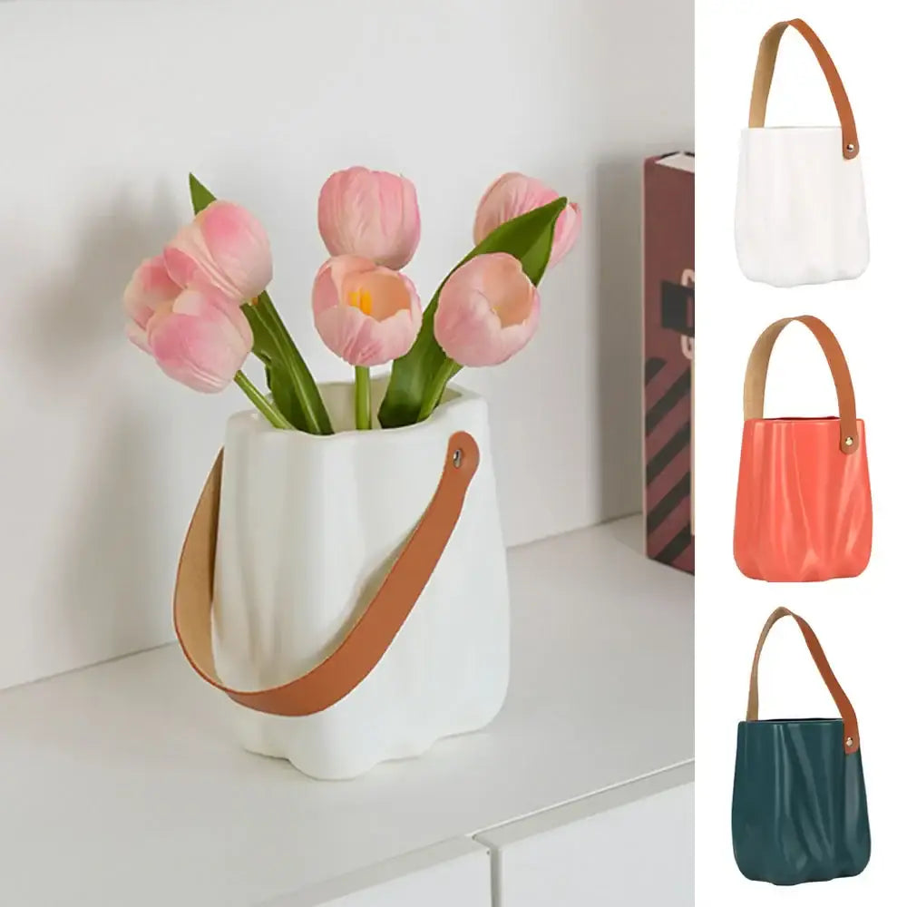 DecorBites™ chic ceramic vase in white with tan leather handle and vertical ridges holding pink tulips for home decoration