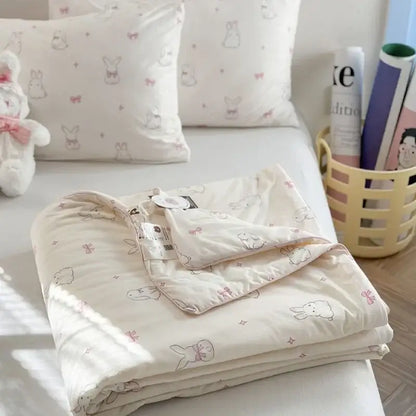 Cream-colored decorbites children cartoon summer cooling quilt with plush texture pastel pink bows and gray bunny illustrations