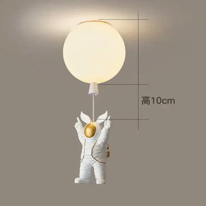 Decorbites children nordic bear astronaut ceiling chandelier with white figurine holding glowing light fixture in gold accents