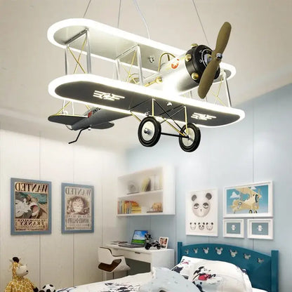 DecorBites™ children’s aircraft led chandelier shaped like a white and black double-decker airplane with gold accents