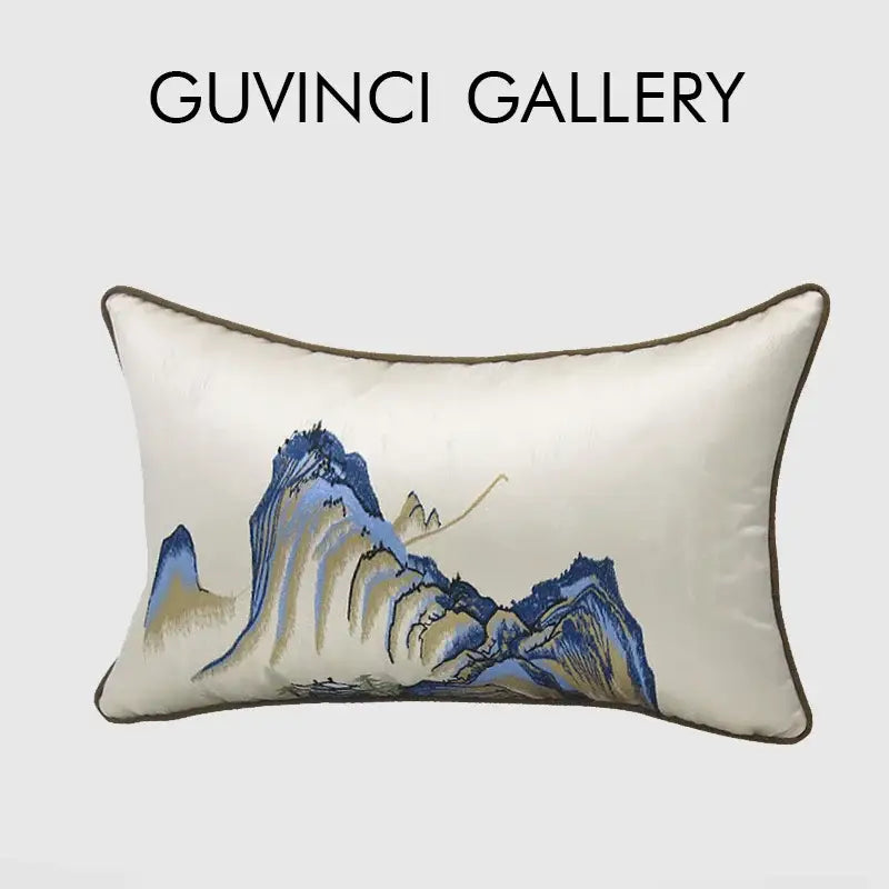 Cream-colored silk pillow cover with chinoiserie landscape embroidered in blue and gold by decorbites