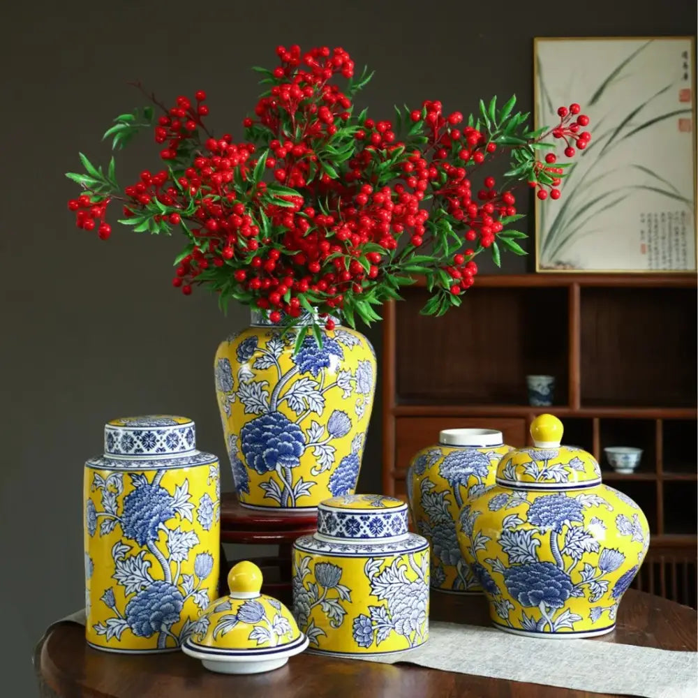 Vibrant yellow ceramic decorbites chinese blue white porcelain general’s jar vase with blue floral patterns and red berries