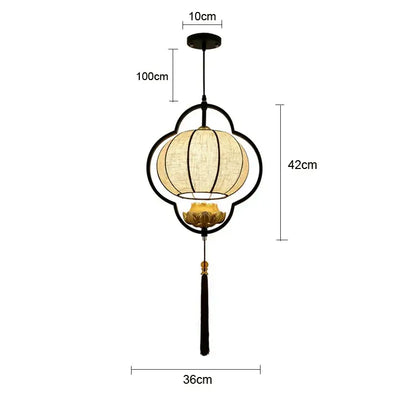 Black metal frame DecorBites™ pendant light with beige woven shade and gold lotus base for elegant tea house decor