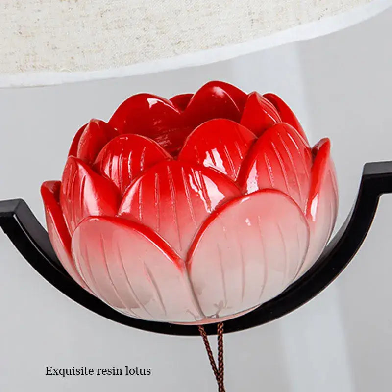 Glossy red-to-white gradient resin lotus ornament with detailed petals suspended by black bracket in decorbites cloth chandelier