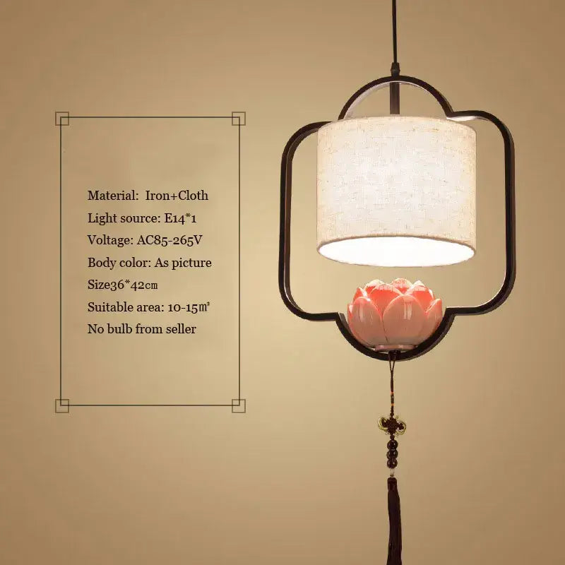 Black iron-framed decorbites cloth chandelier with white cloth shade and pink ceramic lotus flower for bedroom lighting