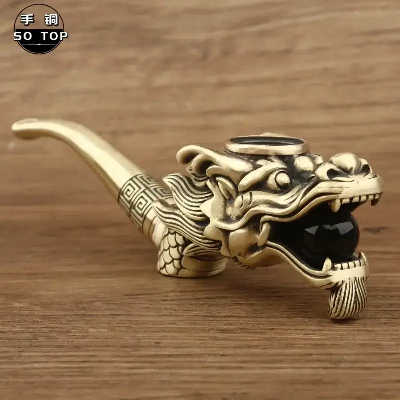 Golden dragon-shaped copper filter pipe with intricate scales and black onyx bead in the mouth decorative use