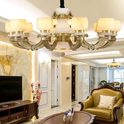 Gold-toned decorbites jade chandelier with ornate detailing and frosted glass shades all-copper lighting fixture