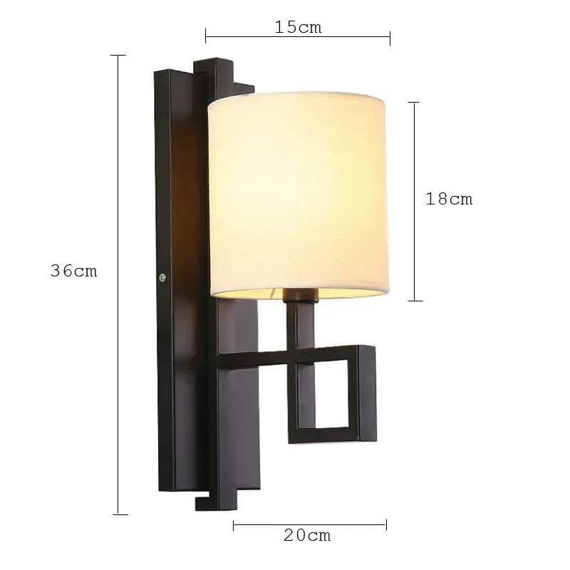 Decorbites™ black metal lantern cloth wall sconce with off-white cylindrical fabric shade for bedroom or corridor lighting