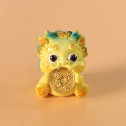 A charming yellow ceramic mythology lion figurine holding a golden coin for luck and wealth by decorbites