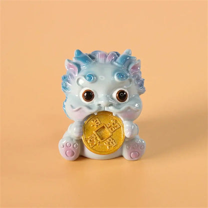 A light blue ceramic mythology lion figurine holding a golden coin from DecorBites™ for luck and wealth