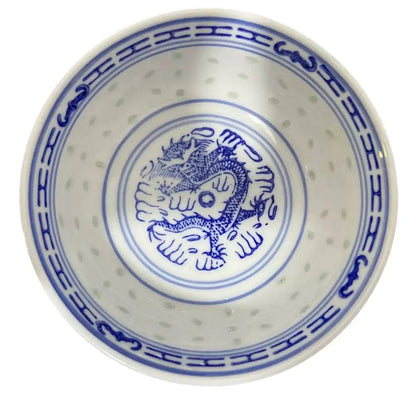 White ceramic decorbites chinese orchid dragon bowl with blue dragon design and perforated rim for dessert or rice