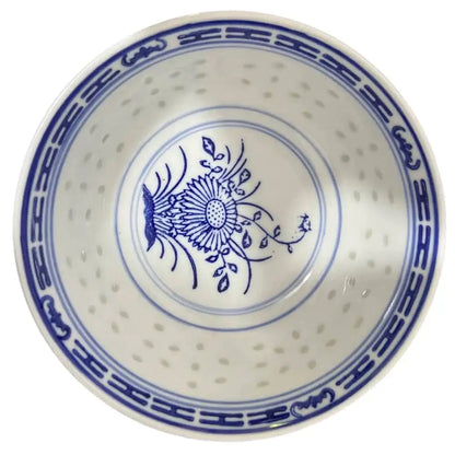 White ceramic decorbites chinese orchid dragon bowl with blue floral patterns and perforated interior for dessert use