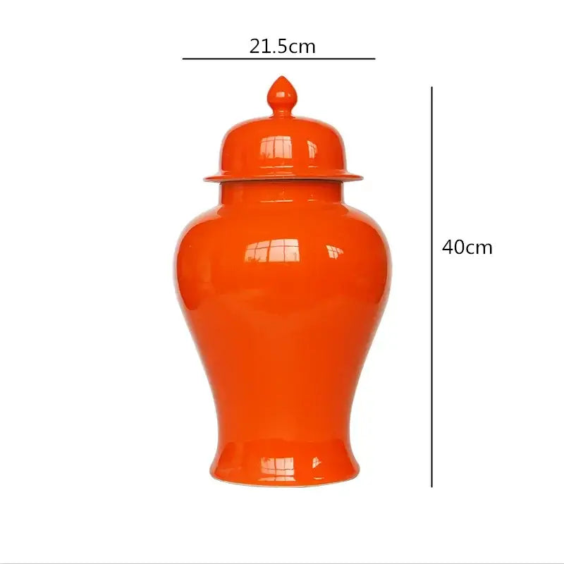 Vibrant orange ceramic general jar vase with matching lid and decorative finial for home decor and storage