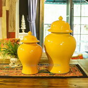 Two glossy yellow ceramic general jar vases with lids in different sizes for home decor and storage by DecorBites