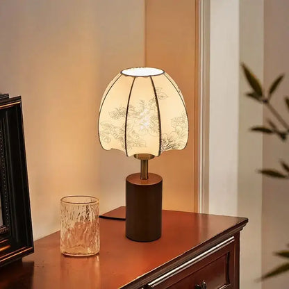 A decorbites chinese retro bedside lamp with cream pleated fabric shade and dark brown cylindrical base