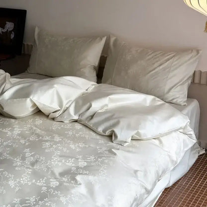 Cream-colored satin duvet cover set with delicate white floral embroidery from decorbites™ cotton jacquard luxury bedding