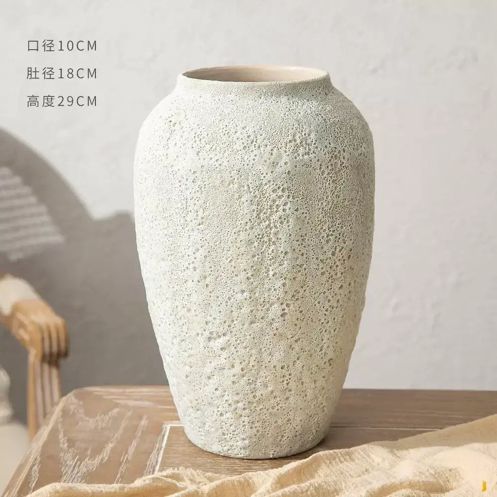 Off-white textured ceramic vase with speckled porous surface and rounded shoulders decorbites chinese style ceramic vase