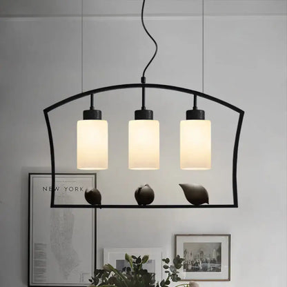 Black metal pendant ceiling lamp with three frosted glass cylinders and bird decor for cylinder island light fixture