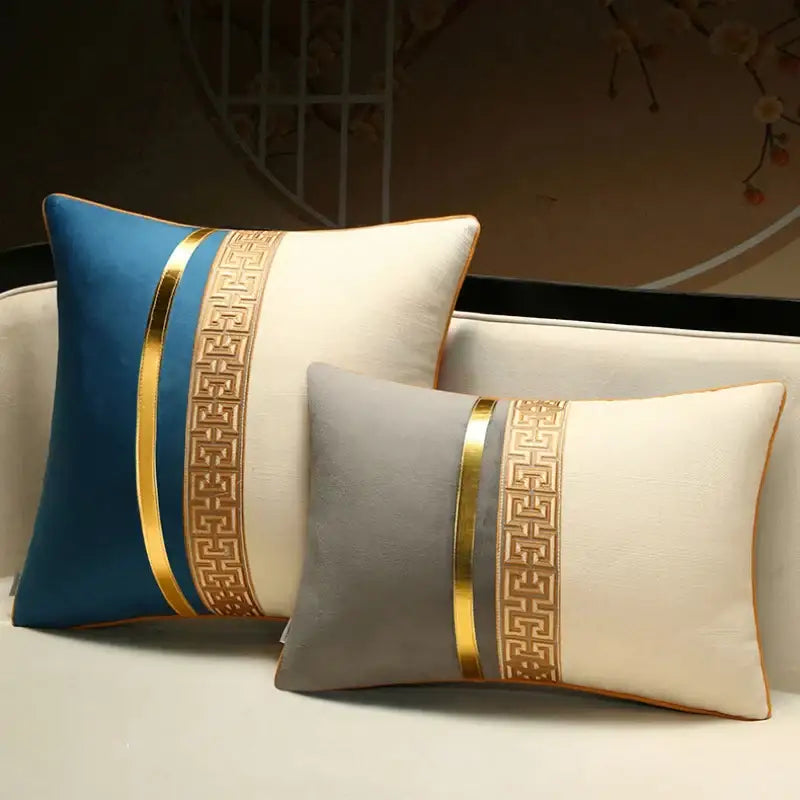 Two rectangular decorative pillow covers by decorbites in deep blue gold and gray cream with geometric trim for sofa and bed