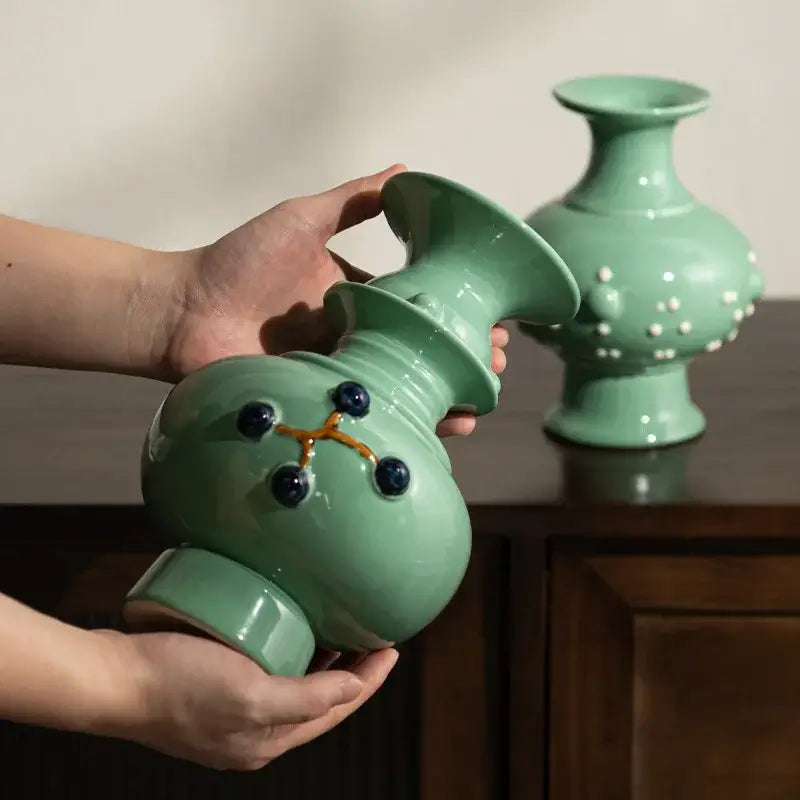 Handcrafted celadon green retro ceramic vase with bulbous body and gold detailed dark blue inlaid dots for home decor