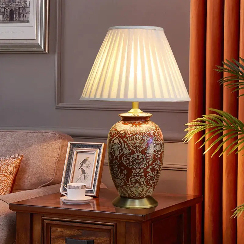DecorBites™ vintage red ceramic table lamp with brown and gold ornate pattern and off-white pleated shade for bedroom