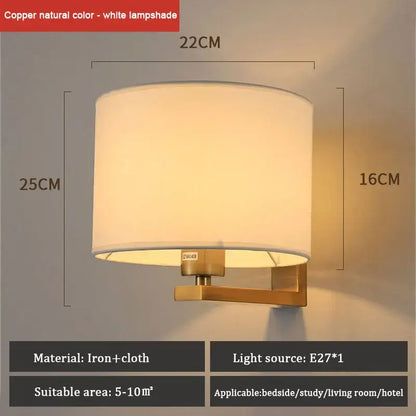 Copper-finished wall lamp with warm cloth cover and cylindrical white fabric shade for bedroom or living room use