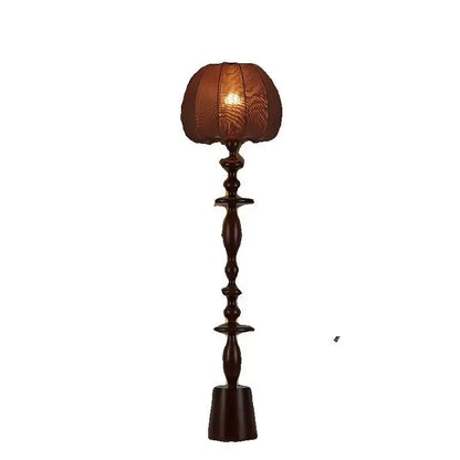 Dark brown wooden floor lamp with textured warm-toned fabric shade from decorbites chinese tassels floor collection