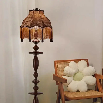 DecorBites chinese tassels floor lamp with dark wood base and lace-patterned gold-fringed shade for warm lighting