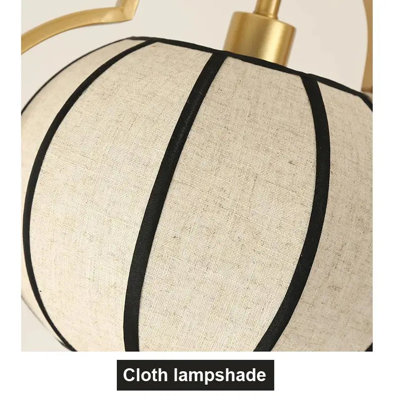Beige linen teahouse lantern chandelier with black vertical stripes and gold-toned metal fixture for elegant lighting