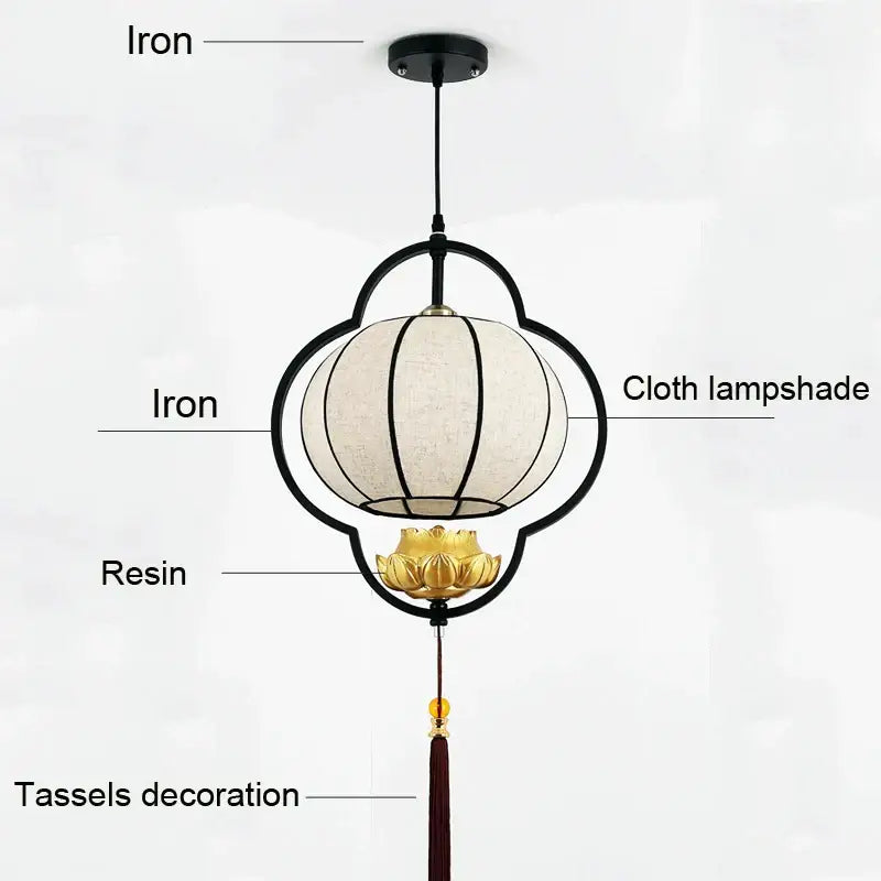 Black iron teahouse lantern chandelier with cream cloth shade gold resin lotus base and dark red tassels for dining room