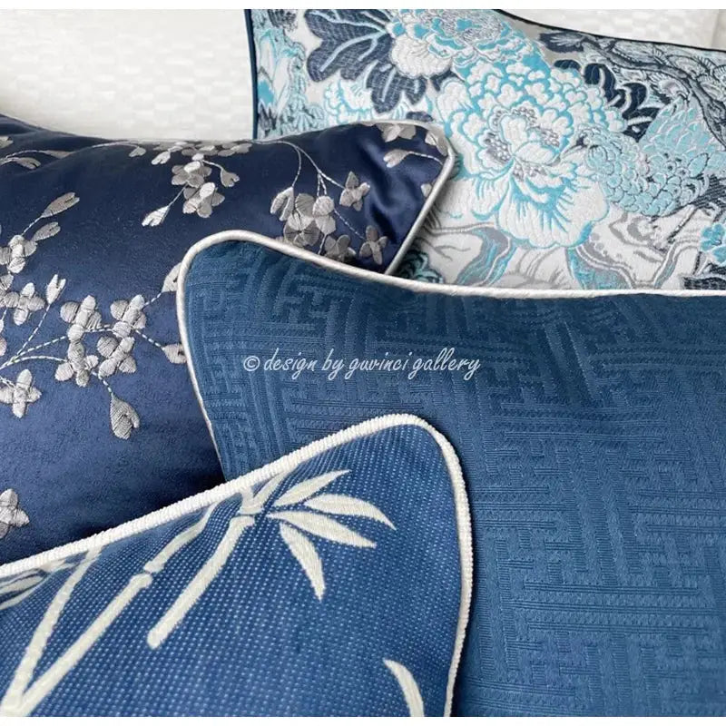 Deep blue embroidered cushion cover with silver floral chinoiserie blue peony design and white piped edge by decorbites chinoiserie blue