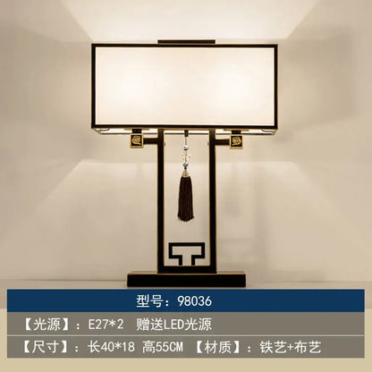 Black metal decorbites chinoiserie table floor lamp with white fabric shade gold accents and hanging dark tassel