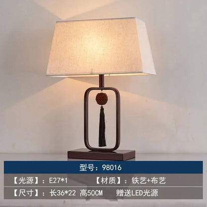 Modern decorbites chinoiserie table floor lamp with beige linen shade and dark bronze frame featuring wooden bead pendant