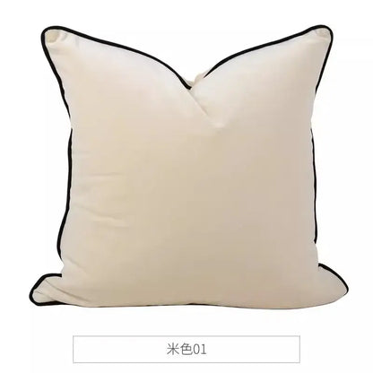 Cream-colored square cushion cover with sleek black piping trim from decorbites chinoiserie zebra peonies collection