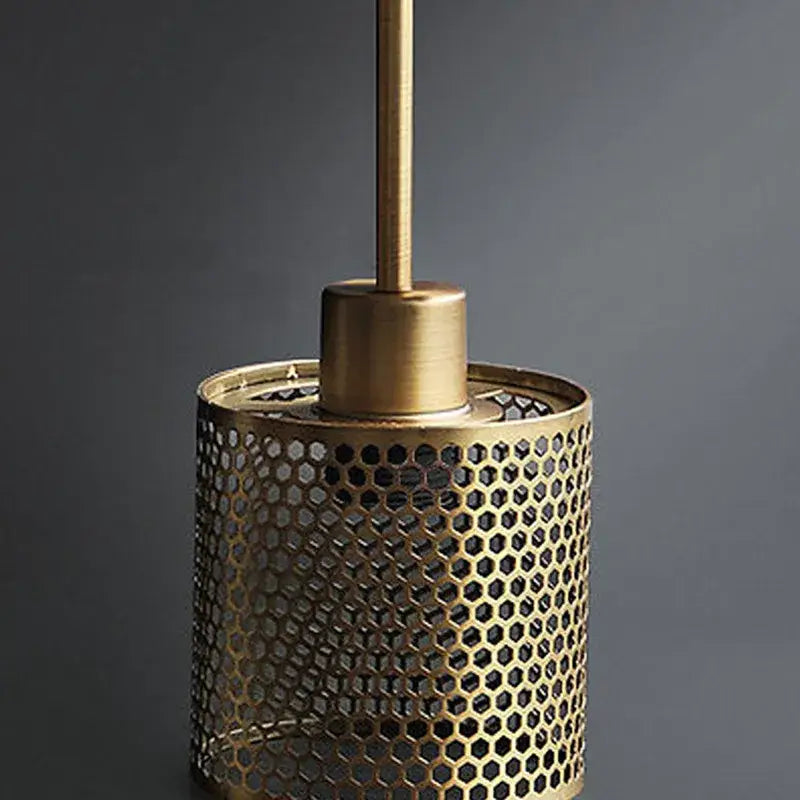 Brass chiswick glass wall light fixture with honeycomb-patterned mesh shade and matching rod for vintage home décor