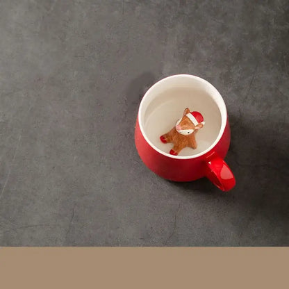 Red porcelain christmas animals ceramic tea cup with a small brown deer figurine wearing a santa hat