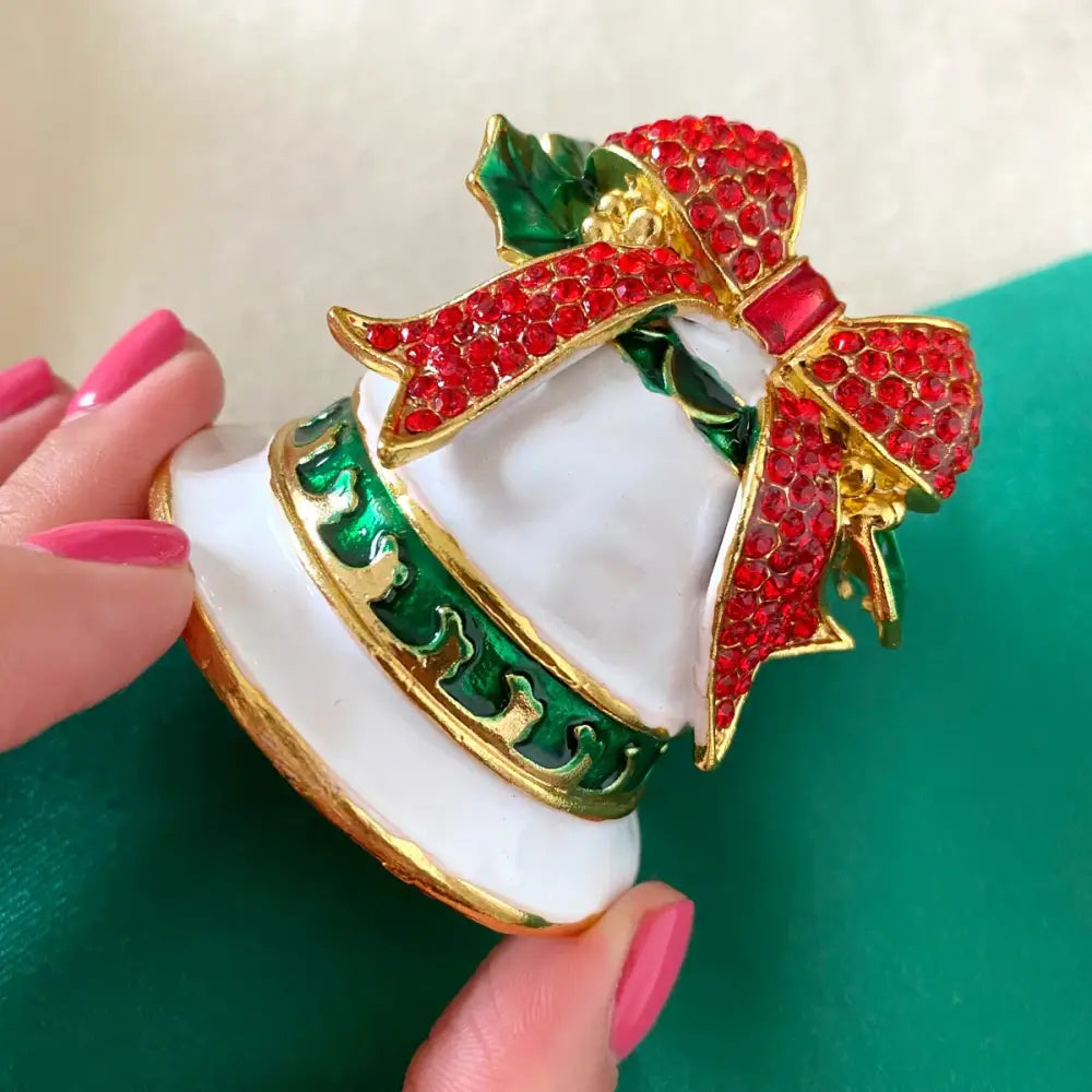 Decorbites™ christmas bell trinket box featuring a white and gold bell ornament with red rhinestones and green holly leaves