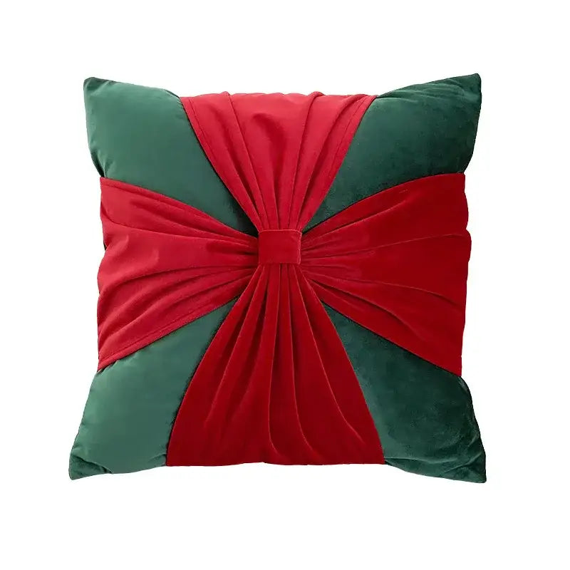Square decorbites christmas bow velvet pillow cover set featuring bold red and deep green bow patchwork design