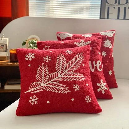 Red plush embroidered pillow with white pine branches and snowflakes from decorbites christmas cartoon collection